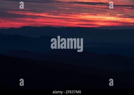 Neon skies over the Shenandoah Valley at sunset from Shenandoah National Park in Virginia. Stock Photo