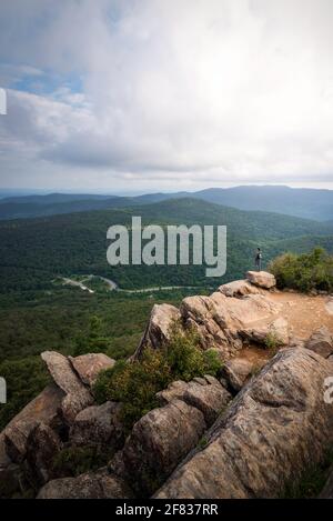 A hiker taking in the views of Shenandoah National Park on a Summer morning. Stock Photo