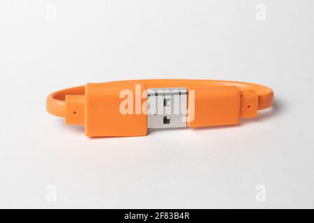 Orange USB cabel isolated on grey background Stock Photo