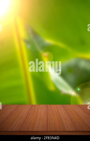 Empty wood table and defocused bokeh blur background with sunlight. Stock Photo