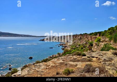 MELLIEHA, MALTA - Sep 21, 2015: The cliffs and rock faults along the Ahrax tal-Mellieha and Ghadira Bay in Malta, on a sunny day in summer. Evidence o Stock Photo