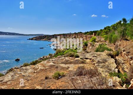 MELLIEHA, MALTA - Sep 21, 2015: The cliffs and rock faults along the Ahrax tal-Mellieha and Ghadira Bay in Malta, on a sunny day in summer. Evidence o Stock Photo