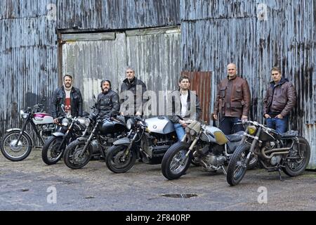 Group of  motorcycle riders having a short break.Group of riders posing with their motorcycles. Stock Photo