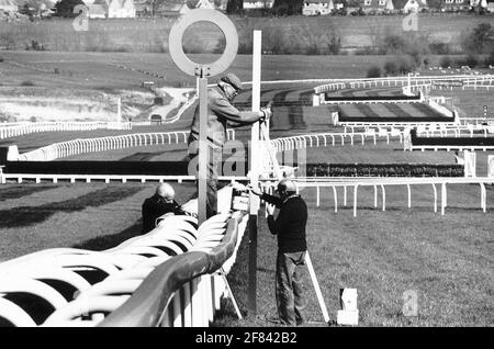 Alan Grant and staff put the finishing touches to the finishing post at Cheltenham Racecourse before the first day of the Cheltenham Festival Stock Photo