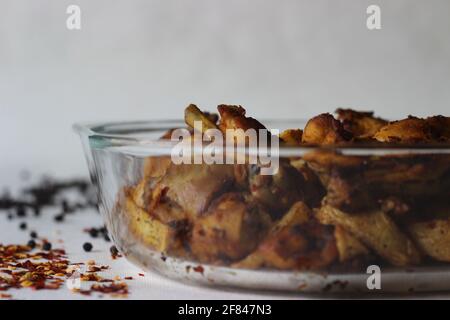 Dry chicken fry and potato wedges, air fried. Shot on white background Stock Photo
