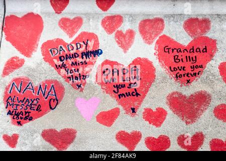 11 April 2021, London, UK - Hearts drawn on the The National COVID Memorial Wall along the South Bank as tribute to those who died during the coronavirus pandemic