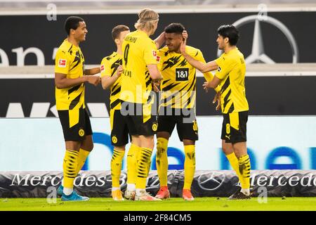10 April 2021, Baden-Wuerttemberg, Stuttgart: Football: Bundesliga, VfB Stuttgart - Borussia Dortmund, Matchday 28 at Mercedes-Benz Arena. Dortmund's Ansgar Knauff (2nd from right) celebrates after his goal to make it 2:3 with Dortmund's Manuel Akanji (l-r), Dortmund's Thorgan Hazard, Dortmund's Erling Haaland and Dortmund's Mahmoud Dahoud. Photo: Tom Weller/dpa - IMPORTANT NOTE: In accordance with the regulations of the DFL Deutsche Fußball Liga and/or the DFB Deutscher Fußball-Bund, it is prohibited to use or have used photographs taken in the stadium and/or of the match in the form of seque Stock Photo