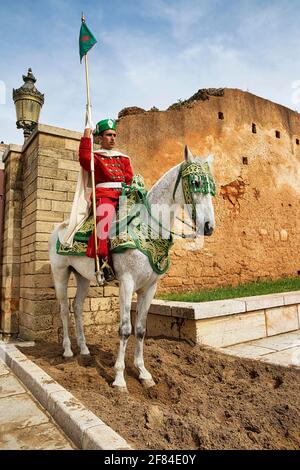 Mounted Guard Soldier In Traditional Dress In Front Of The Unfinished 