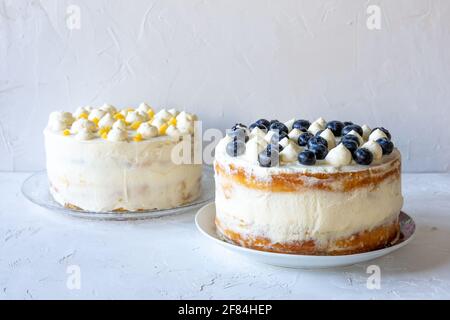 Lemon Victoria Sponge Cakes with Mascarpone Cream and Blueberries and Lemon Curd. Stock Photo