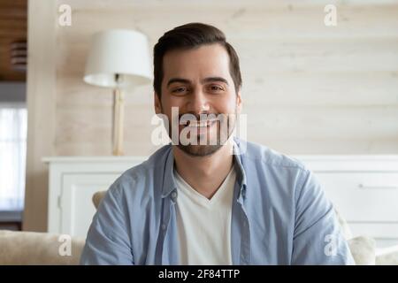 Portrait of smiling man talk on video call Stock Photo