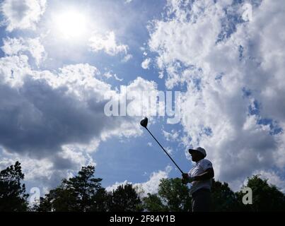 Augusta, United States. 11th Apr, 2021. Xander Schauffele hits his tee shot on the 5th hole in the final round of the 2021 Masters Tournament at the Augusta National Golf Club in Augusta, Georgia on Sunday, April 11, 2021. Photo by Kevin Dietsch/UPI Credit: UPI/Alamy Live News