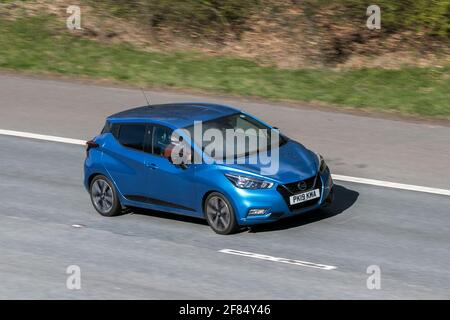 2019 Blue Nissan Micra Yekna Ig-T Cvt 999cc petrol hatchback driving on the M6 motorway near Preston in Lancashire, UK. Stock Photo