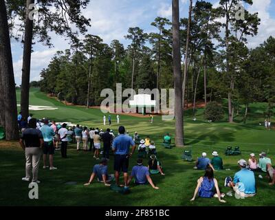 Augusta, United States. 11th Apr, 2021. Patrons watch players putt on the 10th hole in the final round of the 2021 Masters Tournament at the Augusta National Golf Club in Augusta, Georgia on Sunday, April 11, 2021. Photo by Kevin Dietsch/UPI Credit: UPI/Alamy Live News