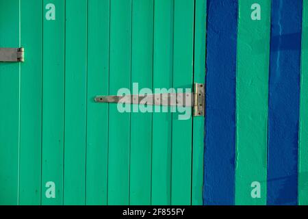 Green painted wooden door. Stock Photo