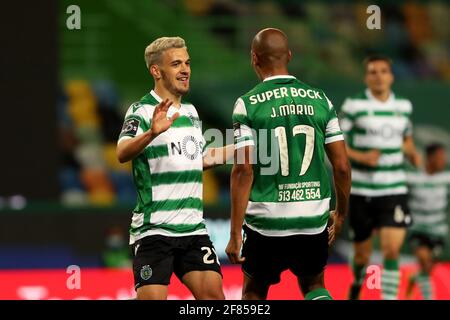 Lisbon, Portugal. 11th Apr, 2021. Pedro Goncalves of Sporting CP (L) celebrates with Joao Mario after scoring a goal during the Portuguese League football match between Sporting CP and FC Famalicao at Jose Alvalade stadium in Lisbon, Portugal on April 11, 2021. Credit: Pedro Fiuza/ZUMA Wire/Alamy Live News Stock Photo