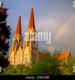 rainbow over the cathedral of saint helena in helena, montana Stock Photo