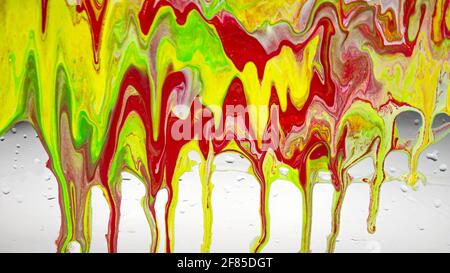 Splashes of acrylic paints, texture of liquid paints mixed in different colors, marble modern, background beautiful colorful drops of drops of paint. Stock Photo