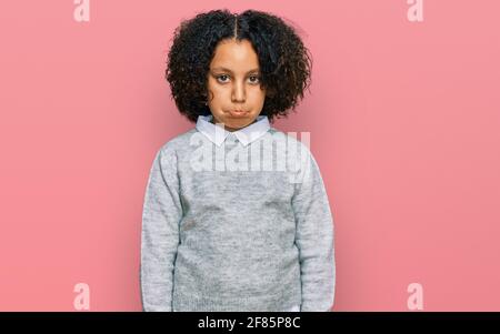 Young little girl with afro hair wearing casual clothes depressed and worry for distress, crying angry and afraid. sad expression. Stock Photo
