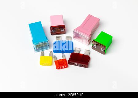 Assorted new vehicle blade fuses and cartridge fuses isolated on white ...