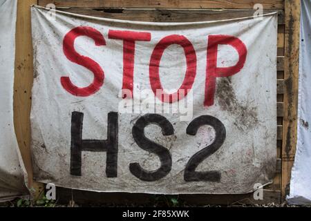 Wendover, UK. 9th April, 2021. A Stop HS2 banner hangs from the exterior of Wendover Active Resistance Camp, which is occupied by activists opposed to the HS2 high-speed rail link. Tree felling work for the project is now taking place at several locations between Great Missenden and Wendover in the Chilterns AONB, including opposite the camp. Credit: Mark Kerrison/Alamy Live News