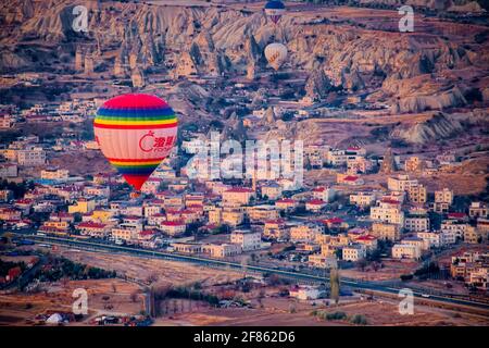 Cappadocia is most famous for the hot air balloon flight. It's an experience one of a kind. The views of the 'fairy chimneys valley' at the sunrise - Stock Photo