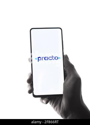 Assam, india - April 10, 2021 : Practo logo on phone screen stock image. Stock Photo