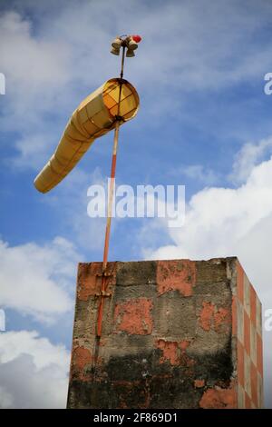 Airfield windsock, used to indicate wind speed and direction, shown ...