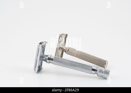 Vintage double edge safety razor for shaving, metal, nickle, and chrome. On white isolated background Stock Photo