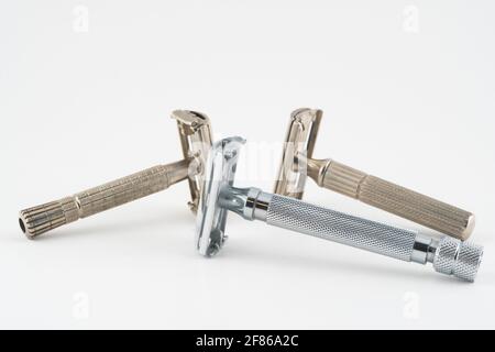 Vintage double edge safety razor for shaving, metal, nickle, and chrome. On white isolated background Stock Photo