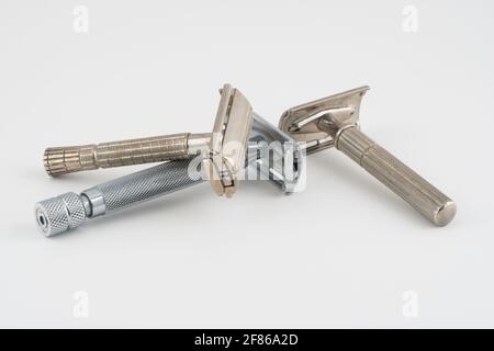 Vintage double edge safety razor for shaving, metal, nickle, and chrome. On white isolated background Stock Photo