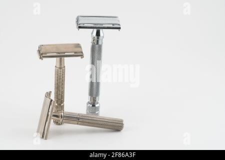 Vintage double edge safety razor for shaving, metal, nickle, and chrome. On white isolated background Stock Photo