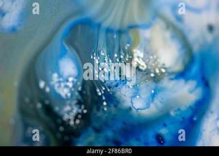 Blue abstract background in fluid art technique. Colorful mix of vibrant colors. Stock Photo