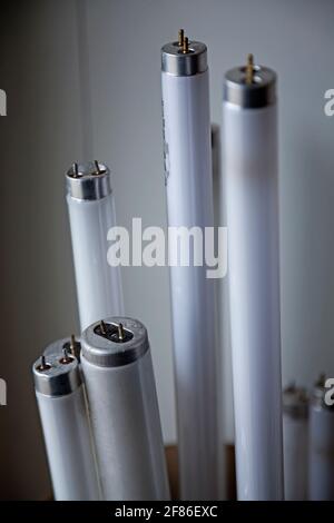 broken fluorescent lamps on their way to recycling Stock Photo