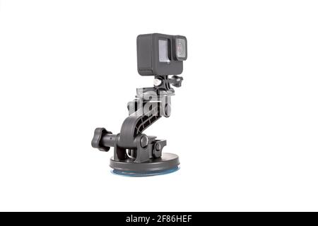 new action camera black color on mount tripod. isolated on white background Stock Photo
