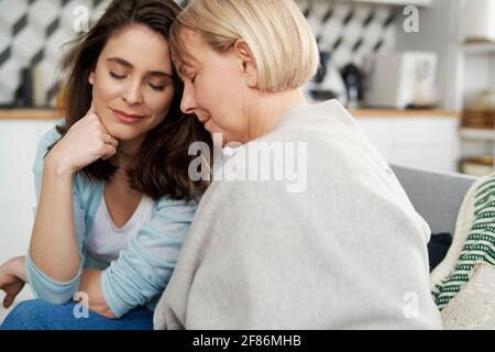 Close up of two sad women at home Stock Photo