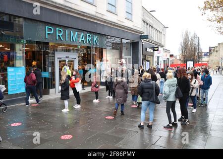 Southampton, Hampshire, UK. 12th April 2021. Shoppers queue outside ...