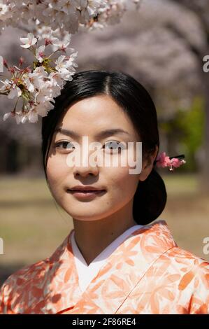 Portrait of a young woman with cherry blossoms Stock Photo - Alamy
