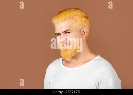 Portrait of smiling bearded man. Barbershop dyed beard and mustache. Handsome male portrait, closeup face. Stock Photo