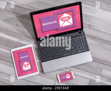 Message concept shown on different information technology devices Stock Photo