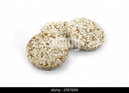 Puffed rice cakes isolated on white. Stack of puffed whole grain crispbread isolated on white. Stock Photo