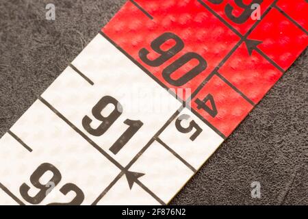 Portion of a tape measure, enlarged image of a centimeter on a color tape measure Stock Photo