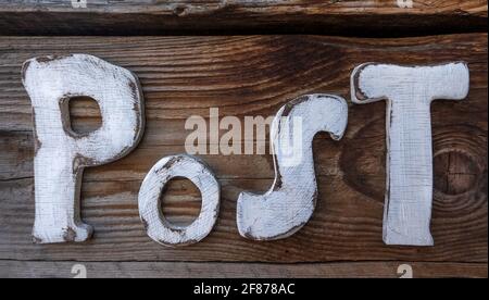 Old sign made of wood with the word Post Stock Photo