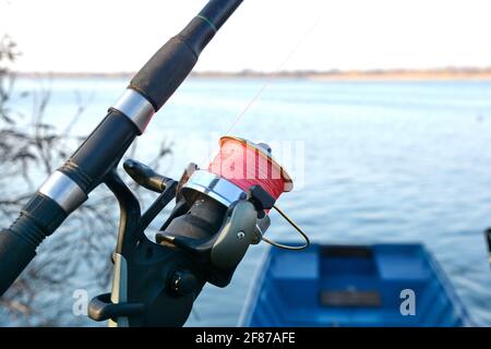 ishing reel on the rod. Fishing on the feeder. Carp fishing rods with
