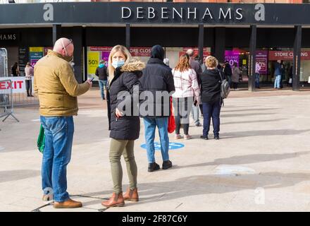 Bournemouth, Dorset, UK. 12th Apr, 2021. Bournemouth re-opens with the easing of Covid-19 restrictions, as non-essential shops are among those to reopen. Long queues at Debenhams as shoppers shop for bargains before the store closes down. Credit: Carolyn Jenkins/Alamy Live News Stock Photo