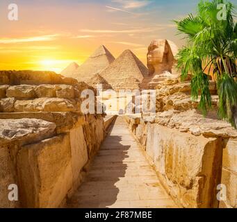 Evening sunshine over pyramids and Sphinx in Giza Stock Photo