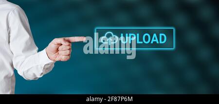 Male hand points to the word upload with icon. Cloud computer uploading concept. Stock Photo