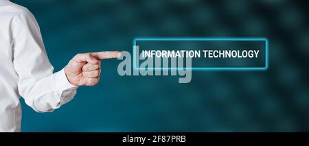 Male hand points to the word information technology against blue background Stock Photo