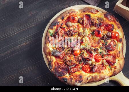 Homemade pizza with salami and mushrooms, top view with copy space Stock Photo