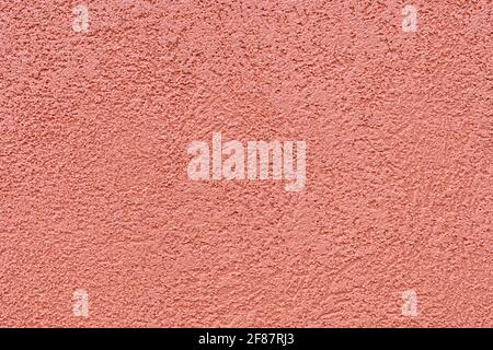 Ocher color texture of the plaster on the exterior walls Stock Photo