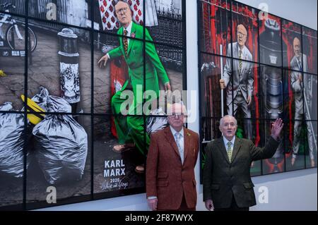 London, UK.  12 April 2021. Gilbert & George in front of 'Karl Marx', and 'Bin Day', both 2020, at their “NEW NORMAL PICTURES” exhibition at White Cube’s Mason’s Yard gallery in Mayfair. The exhibition displays 26 pictures from a new series the pair have been working on for over two years.  The UK government’s coronavirus roadmap out of lockdown has allowed art galleries to reopen today. The exhibition runs 13 April to 8 May 2021. Credit: Stephen Chung / Alamy Live News Stock Photo